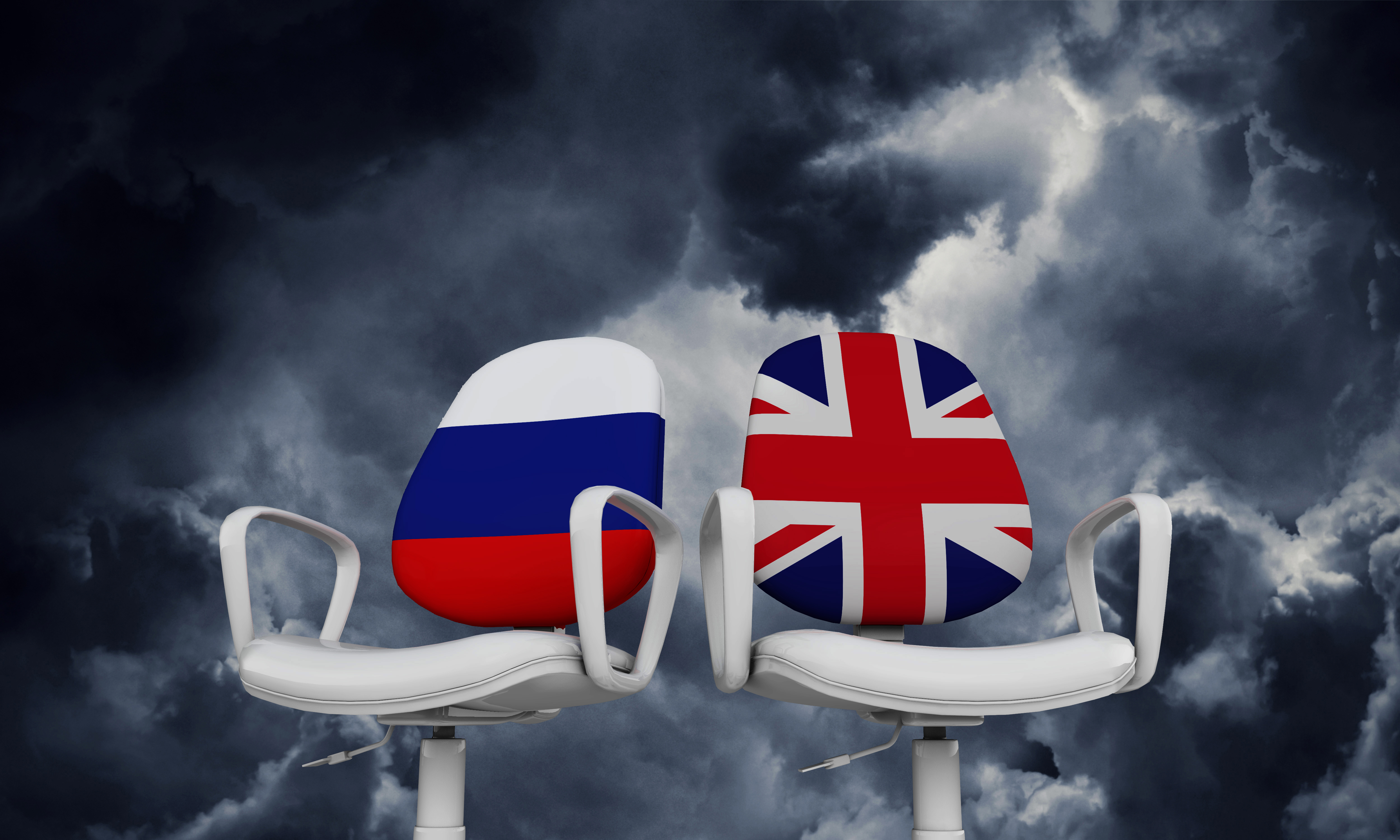 chairs infront of sky with France and United Kindom flags on